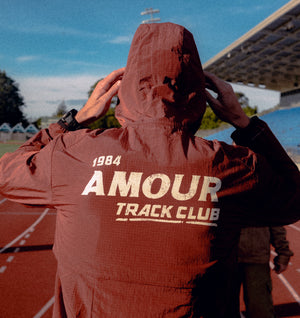 Track Club Windbreaker - Brick